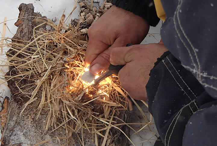 Learning to Light a Fire with a Striker, a real Survival Skills