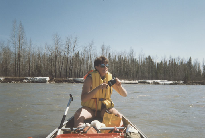 Paddling along Ice Lined River Banks