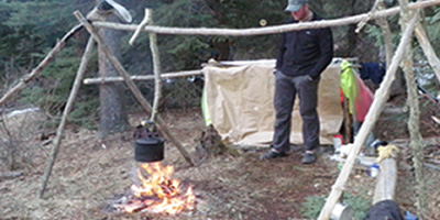 Cooking Tripod & Fire beside a Shelter