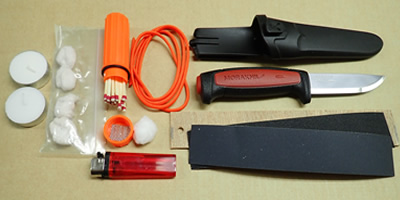 Course fire lighting kit, survival knife and sharpening board